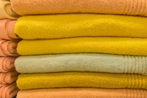 Folded Laundry Gold Shutterstock 2225879217